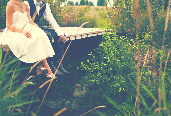 Couple on Romantic Bridge After Wedding