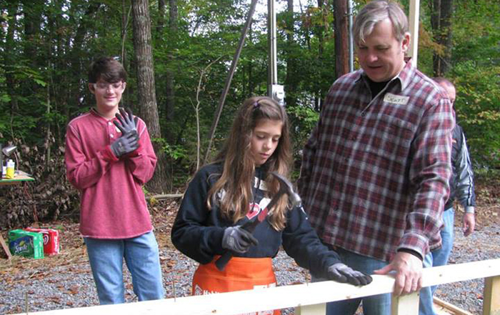 Gibbs family participates in Harley House build.